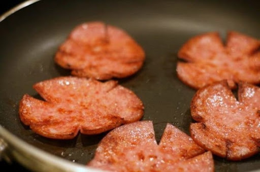Credits in comments pork roll cooking in a pan